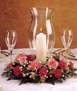 Hurricane lamps wedding centerpiece with flowers