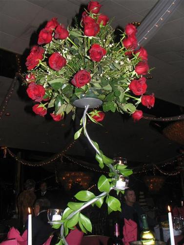 Re need red rose centerpiece pics here is a pic from the wedding i went to